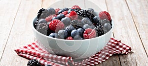 Fresh assortment berries on wooden table