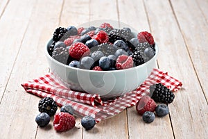 Fresh assortment berries on wooden table