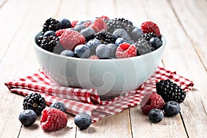 Fresh assortment berries on wooden table