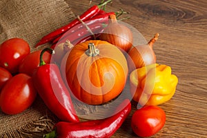 Fresh autumn vegetables lie on sacking