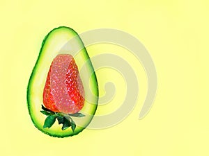 Fresh Avocado cut half and slice with strawberry and strawberry flower on white background