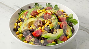 Fresh Avocado, Tomato, Corn, and Black Bean Salad Bowl on Marble Background