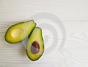 Fresh avocado on white wooden lunch