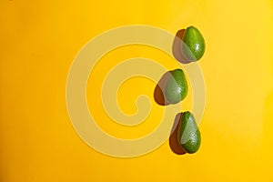 Fresh avocados on color background