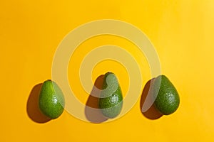 Fresh avocados on color background