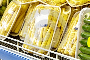 Fresh baby corn in plastic package