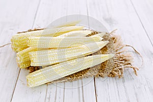 Fresh Baby corn on wooden background