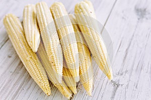 Fresh Baby corn on wooden background