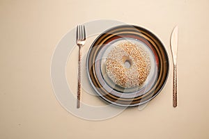 fresh bagel bread on a plate on table