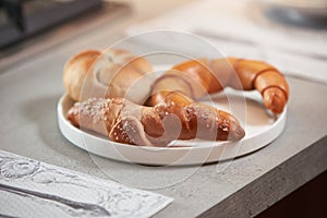 Fresh bagel croissant on a white plate