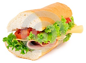 Fresh baguette sandwich with ham, cheese, tomatoes, and lettuce