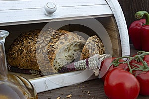 Fresh baked Bread in wooden breadbox