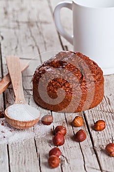 Fresh baked browny cake, milk, sugar, hazelnuts