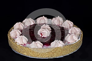 Fresh baked cherry pie with whipped cream decorations on top