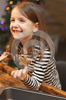 Fresh baked cookie on a children hand