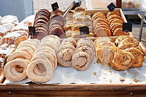 Fresh baked cookies at a counter. Market bakery or cafe outdoors.