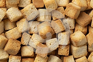 Fresh baked croutons for seasoning close up full frame