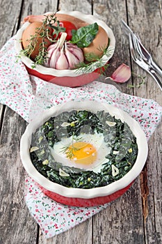 Fresh baked egg with spinach