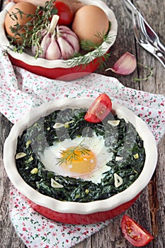 Fresh baked egg with spinach