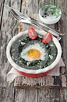 Fresh baked egg with spinach