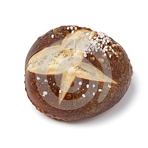 Fresh baked German pretzel bun close up on white background
