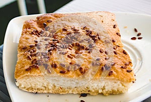Fresh baked gluten free bread bap sprinkled with seeds