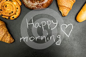 Fresh baked goods on a black background, the words