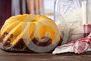 Fresh baked marble gugelhupf sweet bread with curtains