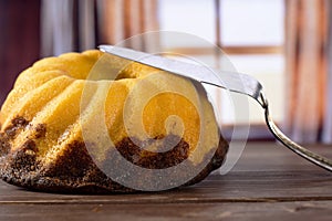 Fresh baked marble gugelhupf sweet bread with curtains
