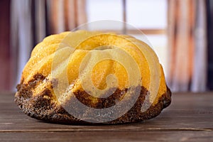 Fresh baked marble gugelhupf sweet bread with curtains