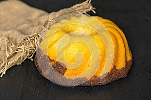 Fresh baked marble gugelhupf sweet bread on grey stone