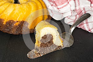 Fresh baked marble gugelhupf sweet bread on grey stone