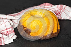 Fresh baked marble gugelhupf sweet bread on grey stone