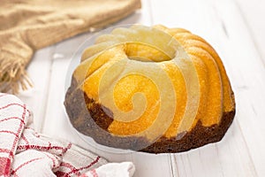 Fresh baked marble gugelhupf sweet bread on grey wood