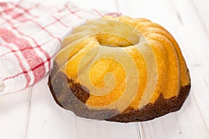 Fresh baked marble gugelhupf sweet bread on grey wood