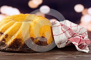 Fresh baked marble gugelhupf sweet bread with lights