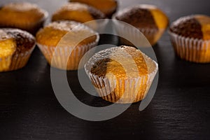 Fresh baked marble muffin on grey stone
