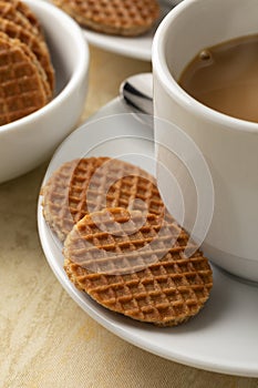 Fresh baked mini stroopwafels, syrup waffles, and a cup of coffee