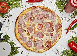 Fresh baked pizza on vegetables background