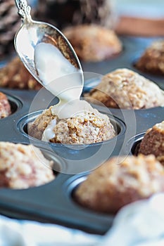 Fresh Baked Pumpkin Muffins in Baking Pan with Icing