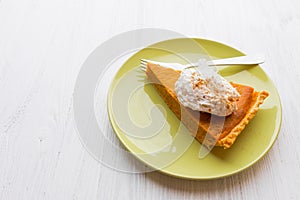 Fresh baked pumpkin pie slice