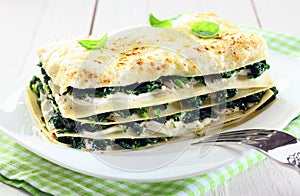 Fresh baked vegetarian spinach lasagna on a plate