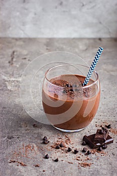 Fresh banana and chocolate smoothie in glass