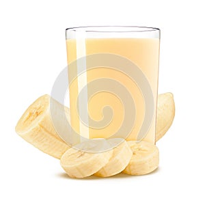 Fresh banana shake in a glass and banana pieces on white background