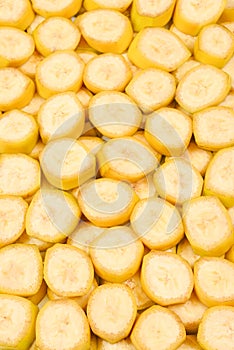 Fresh banana slices background. Top view