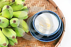 Fresh Banana and sweet desert in white plate .