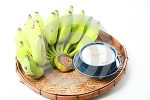 Fresh Banana and sweet desert in white plate .