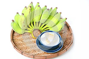 Fresh Banana and sweet desert in white plate .