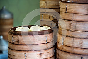 Fresh baozi in bamboo steamer on Chinese food street