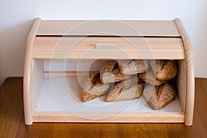 Fresh baquette breads in wooden casket